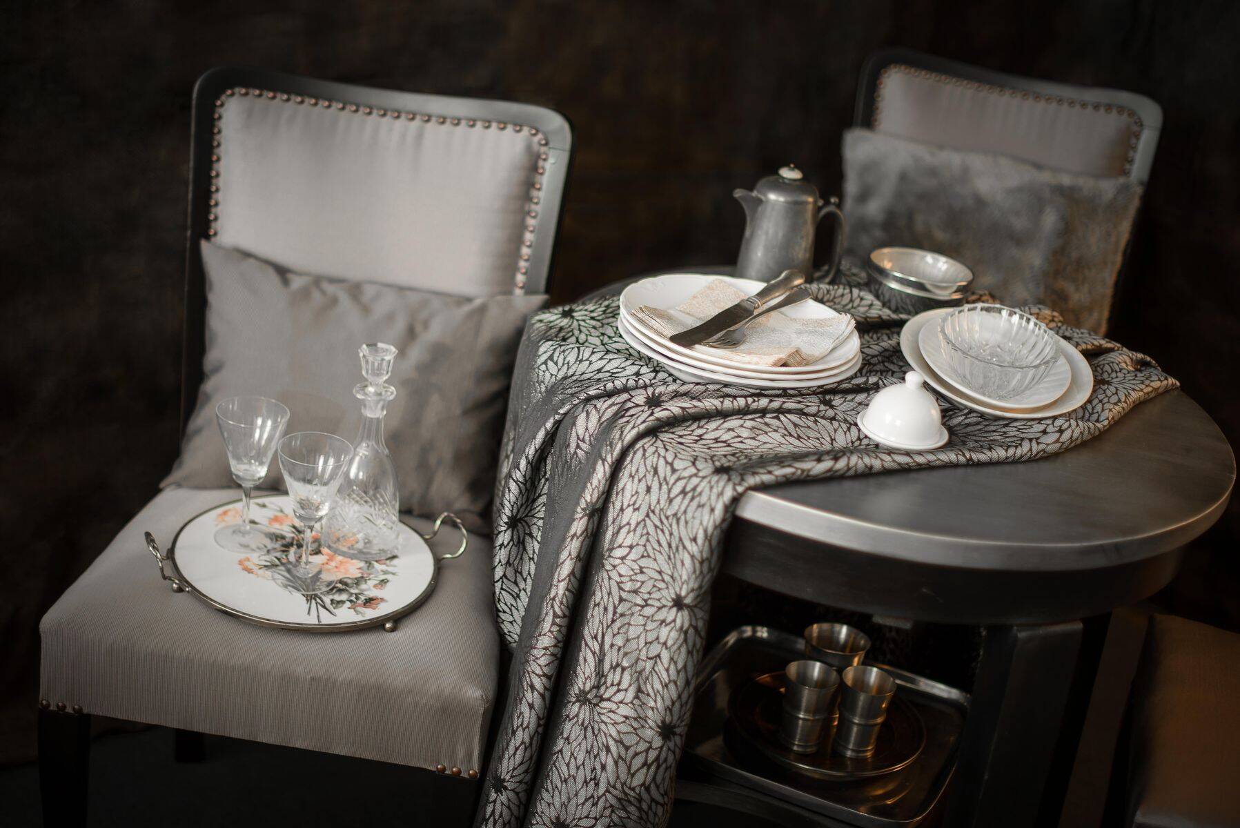 Round Art Deco black painted wooden side table with lower shelf, 1930s.