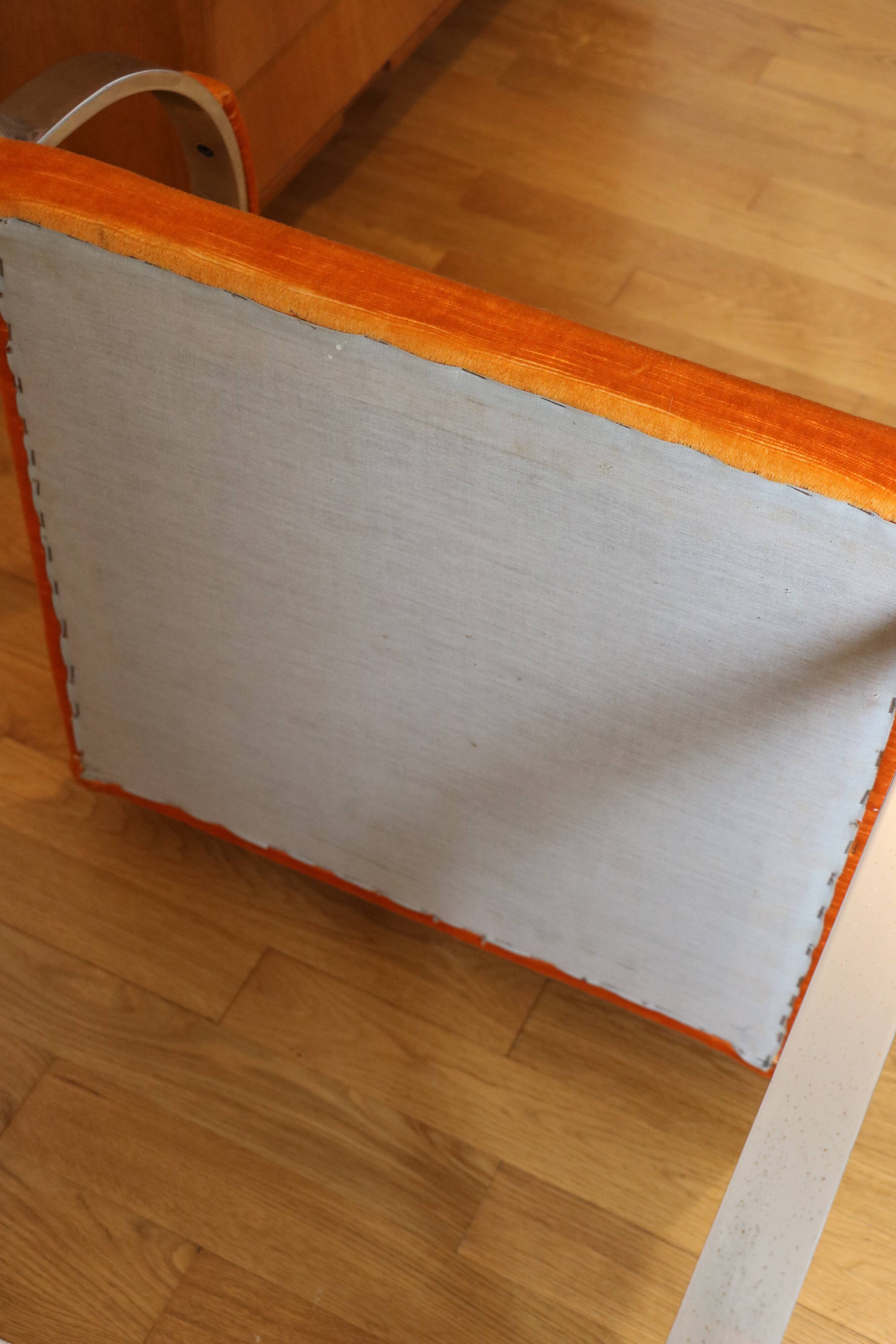 Chrome-plated metal and orange fabric armchair, 1970