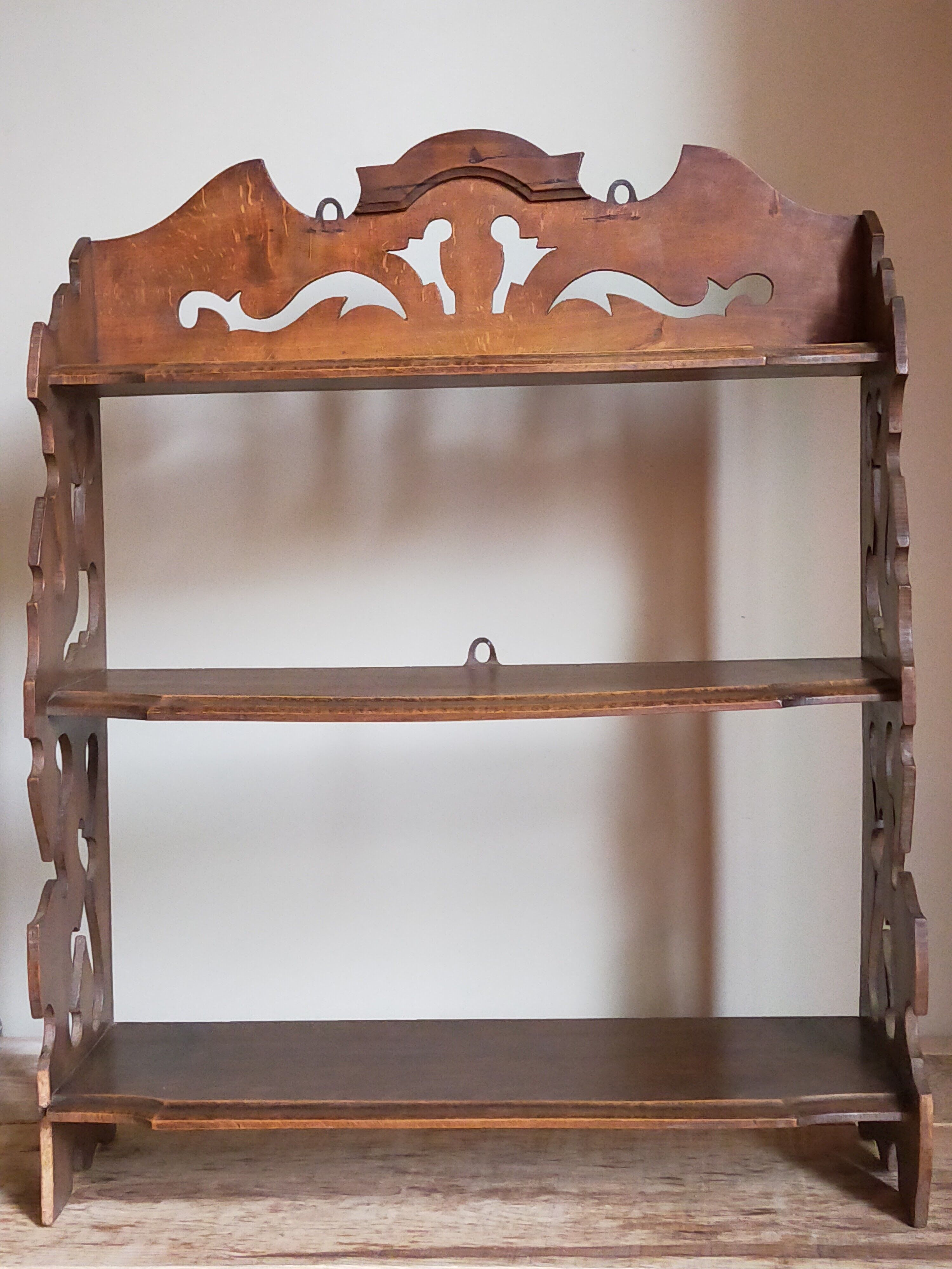 Old carved wooden wall shelf