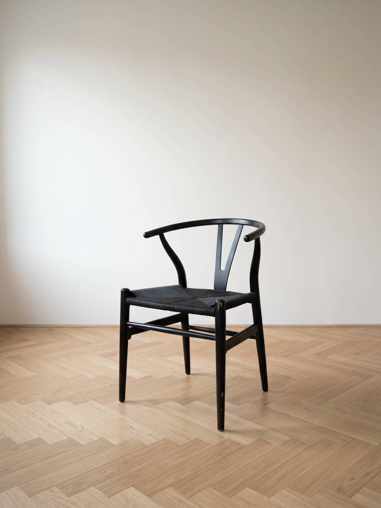 Set of 4 vintage Scandinavian Wishbone style chairs in black wood.