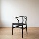 Set of 4 vintage Scandinavian Wishbone style chairs in black wood.