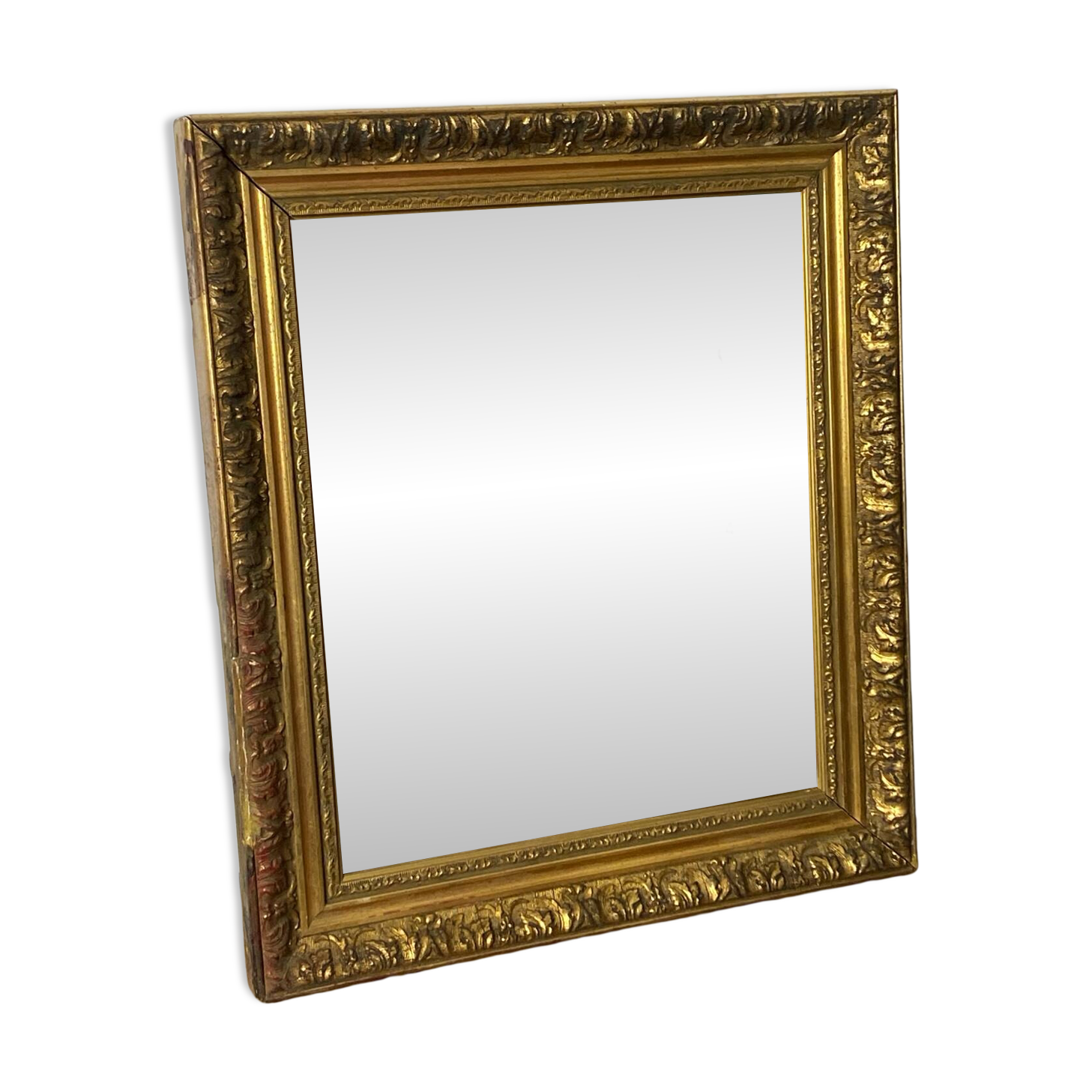 Antique mirror in carved gilded wood