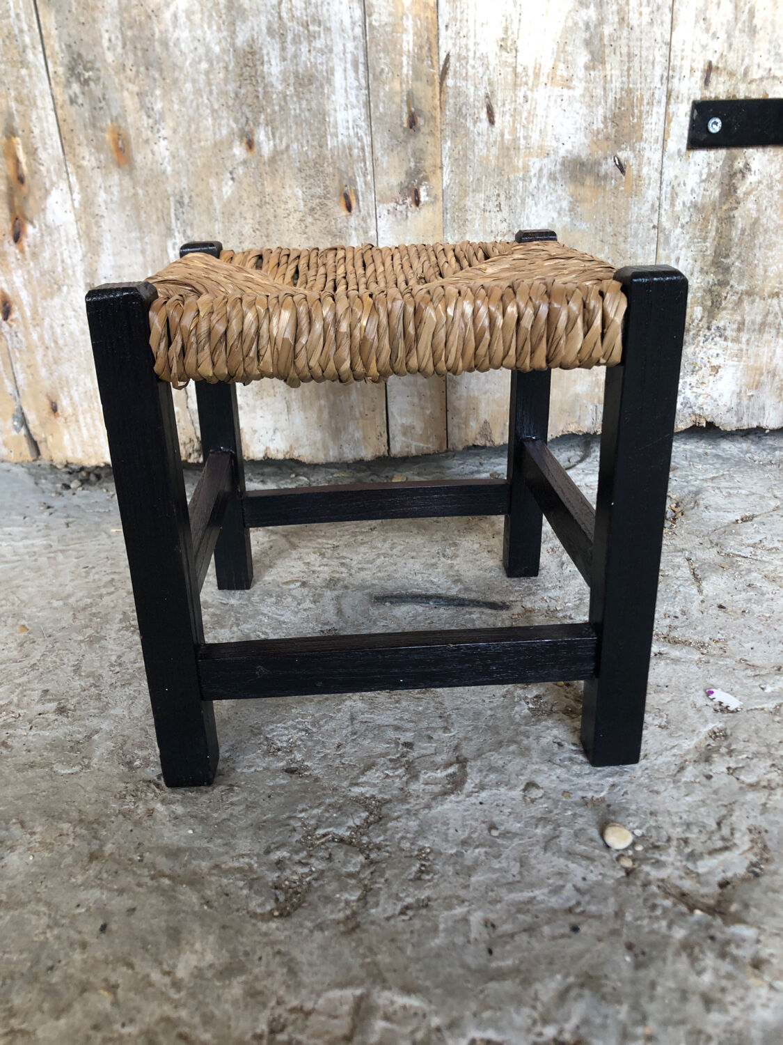 Black wood foot rest stool & vintage mulched seat