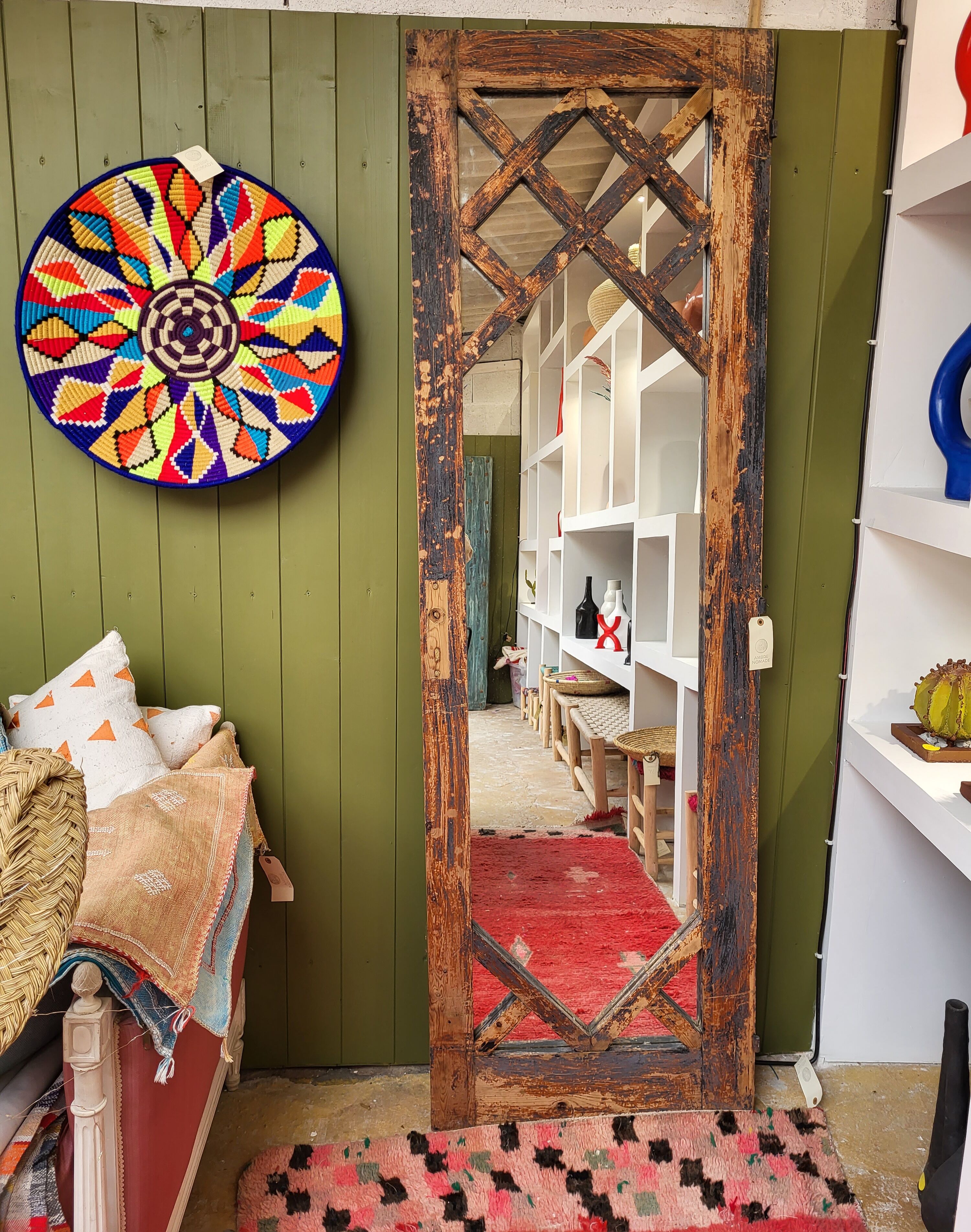 Wooden mirror mounted on old door