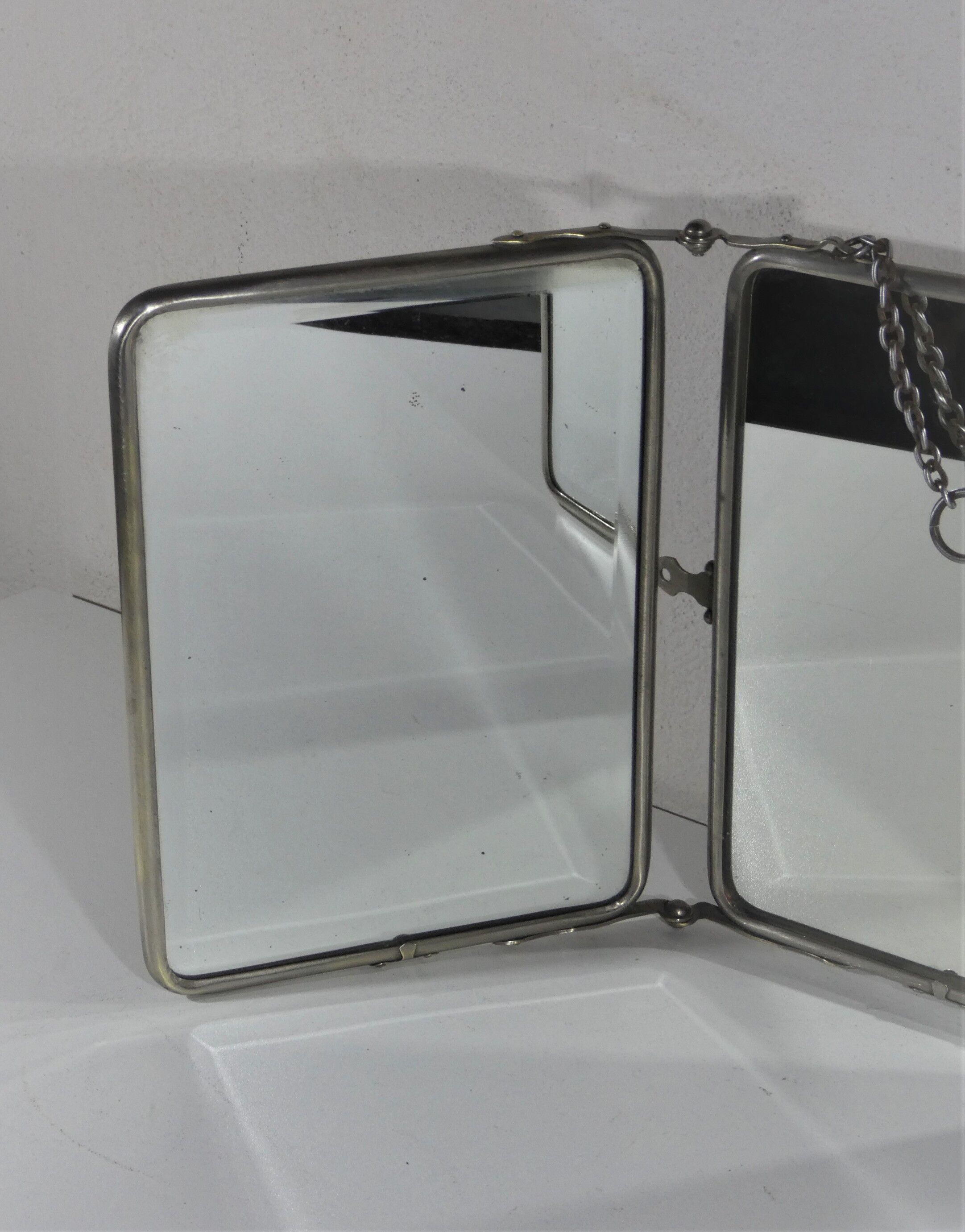 Tryptic barber mirror