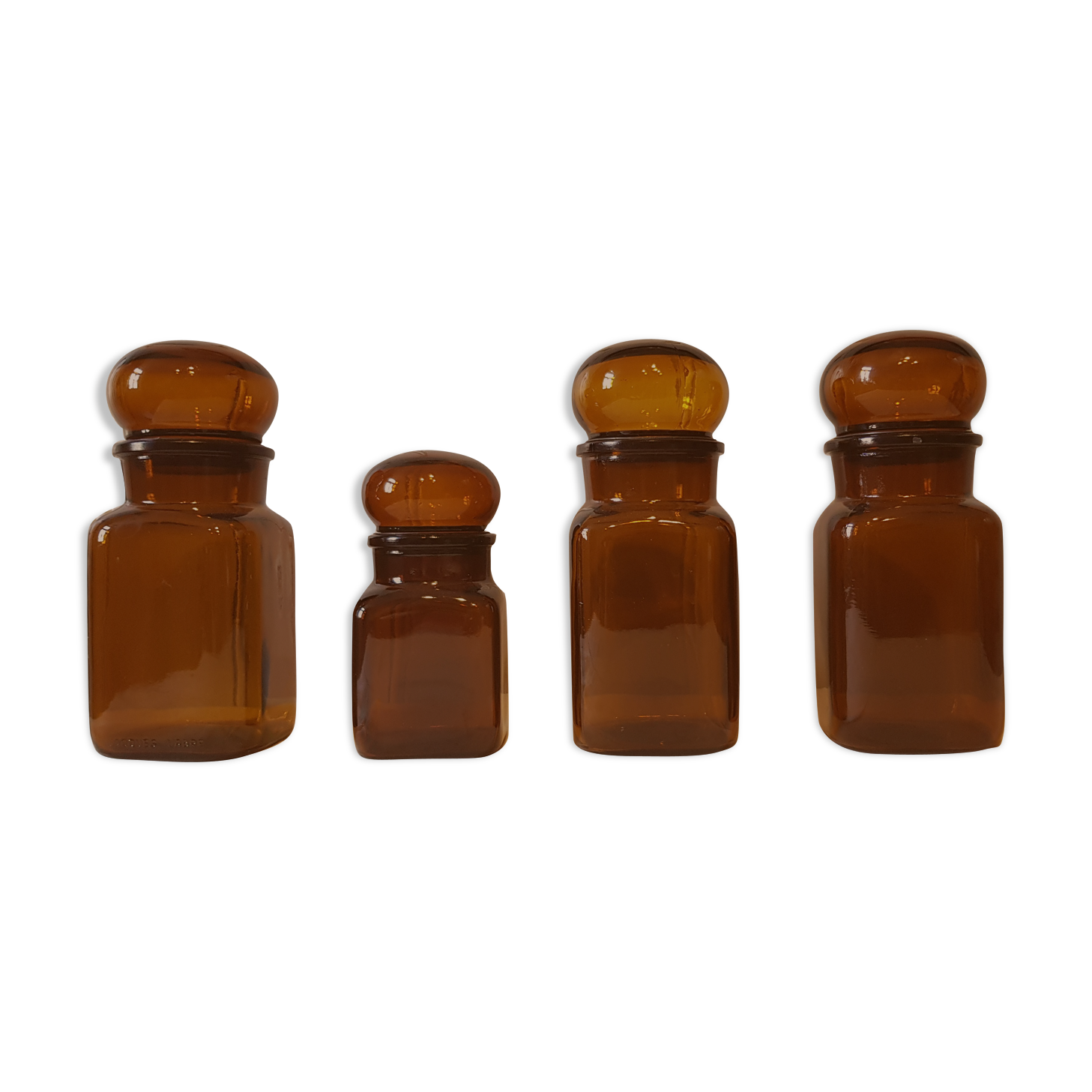 Series of 4  amber glass jars 70