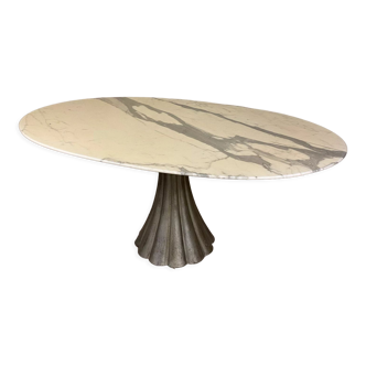 Oval marble dining table with iron base