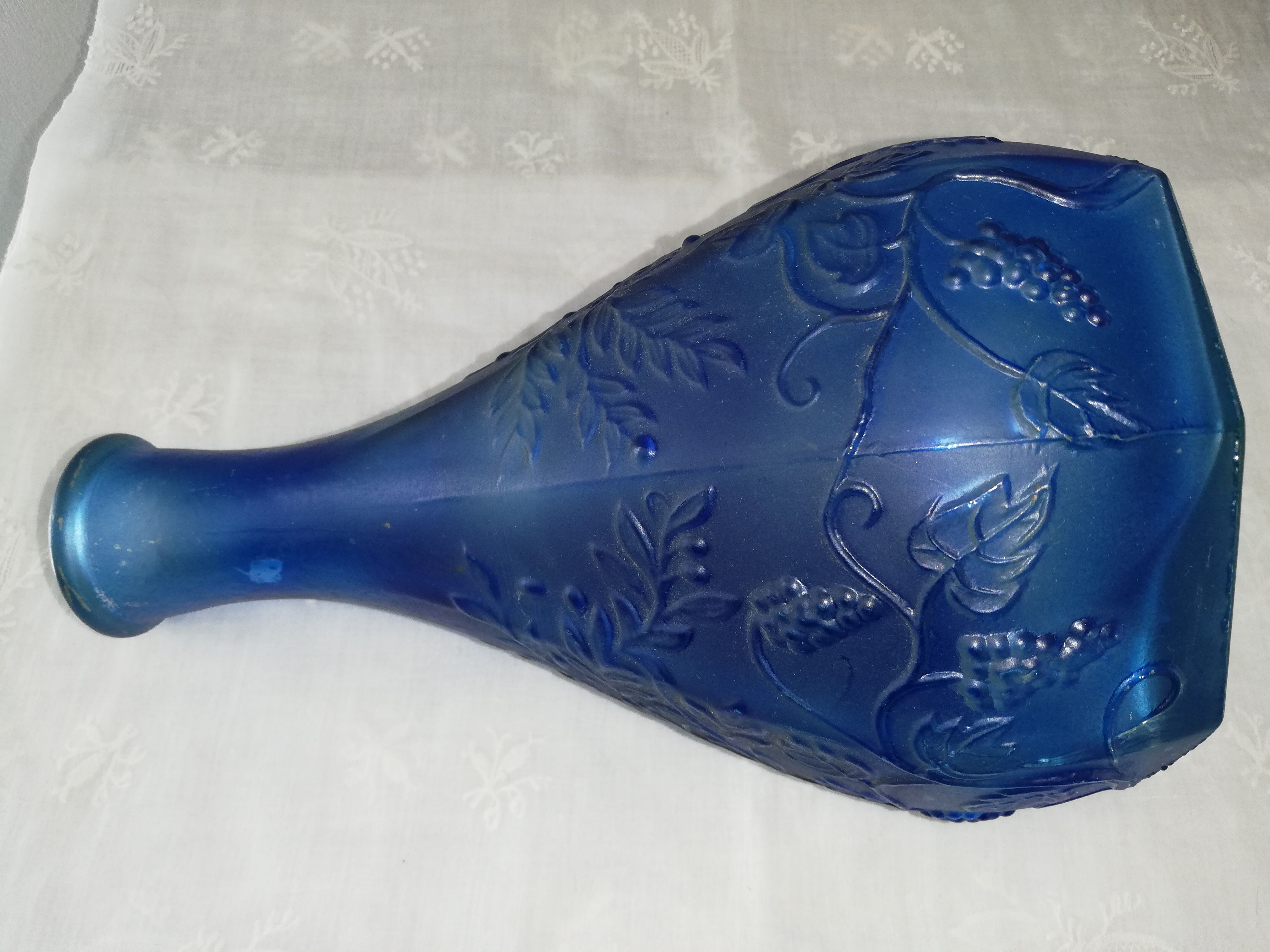 Blue glass bottle, engraved molded