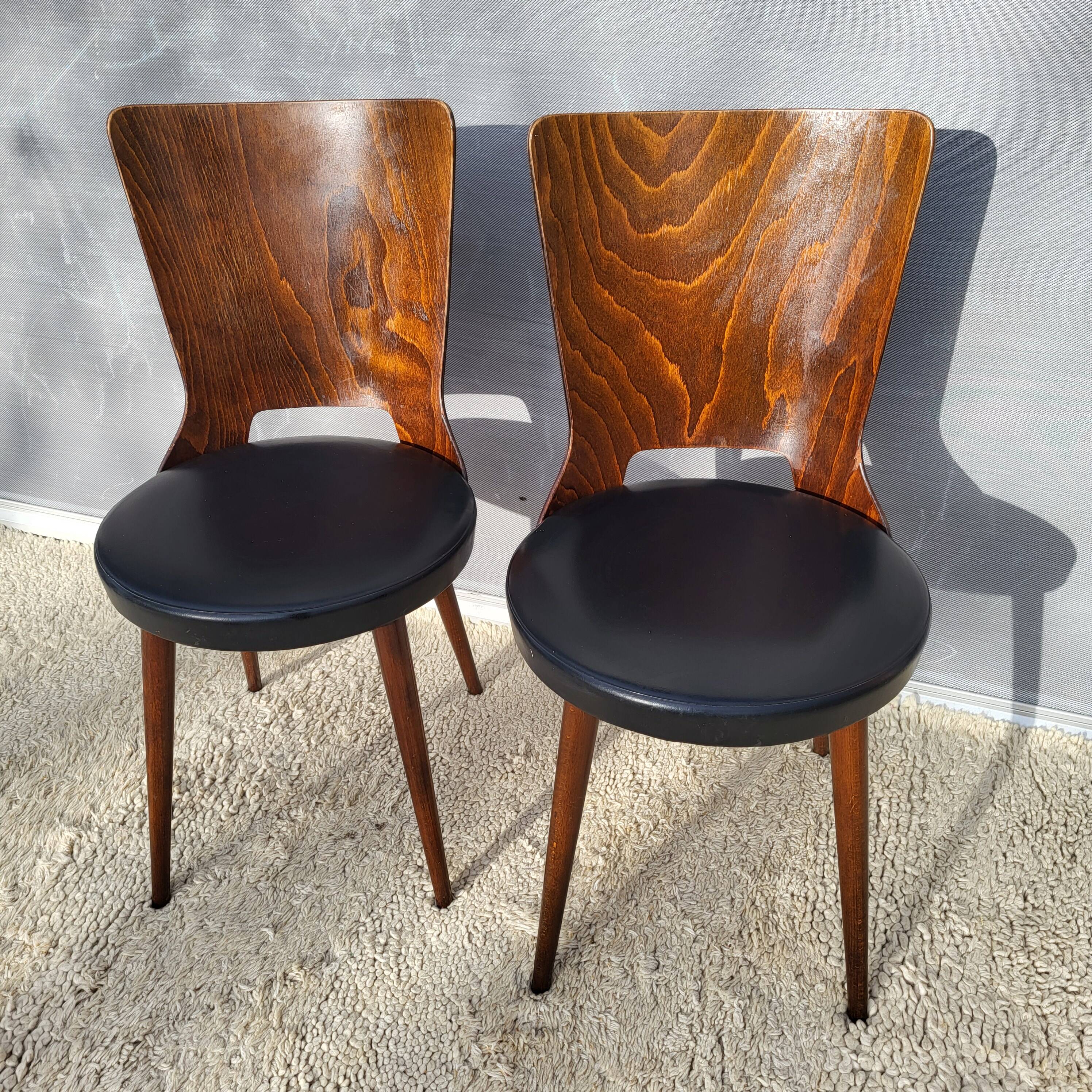 Pair of Dove chairs • Baumann • Black faux leather