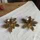 Pair of candlesticks, holly leaves, in brass