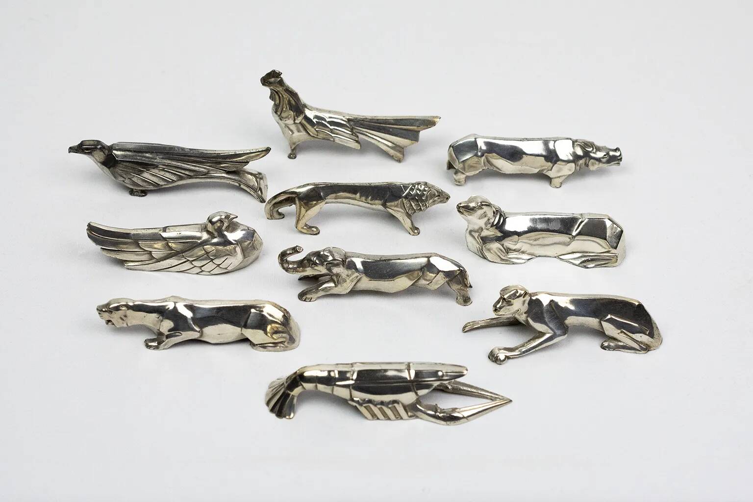 10 porte-couteaux animaliers Art déco en métal argenté – dlg Sandoz, Gallia