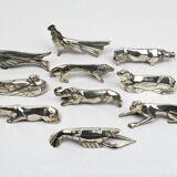 10 porte-couteaux animaliers Art déco en métal argenté – dlg Sandoz, Gallia