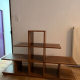 Low wooden shelf in 1960s brutalist style.