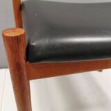 Danish designed footstool in teak wood and black skai “imitation leather”