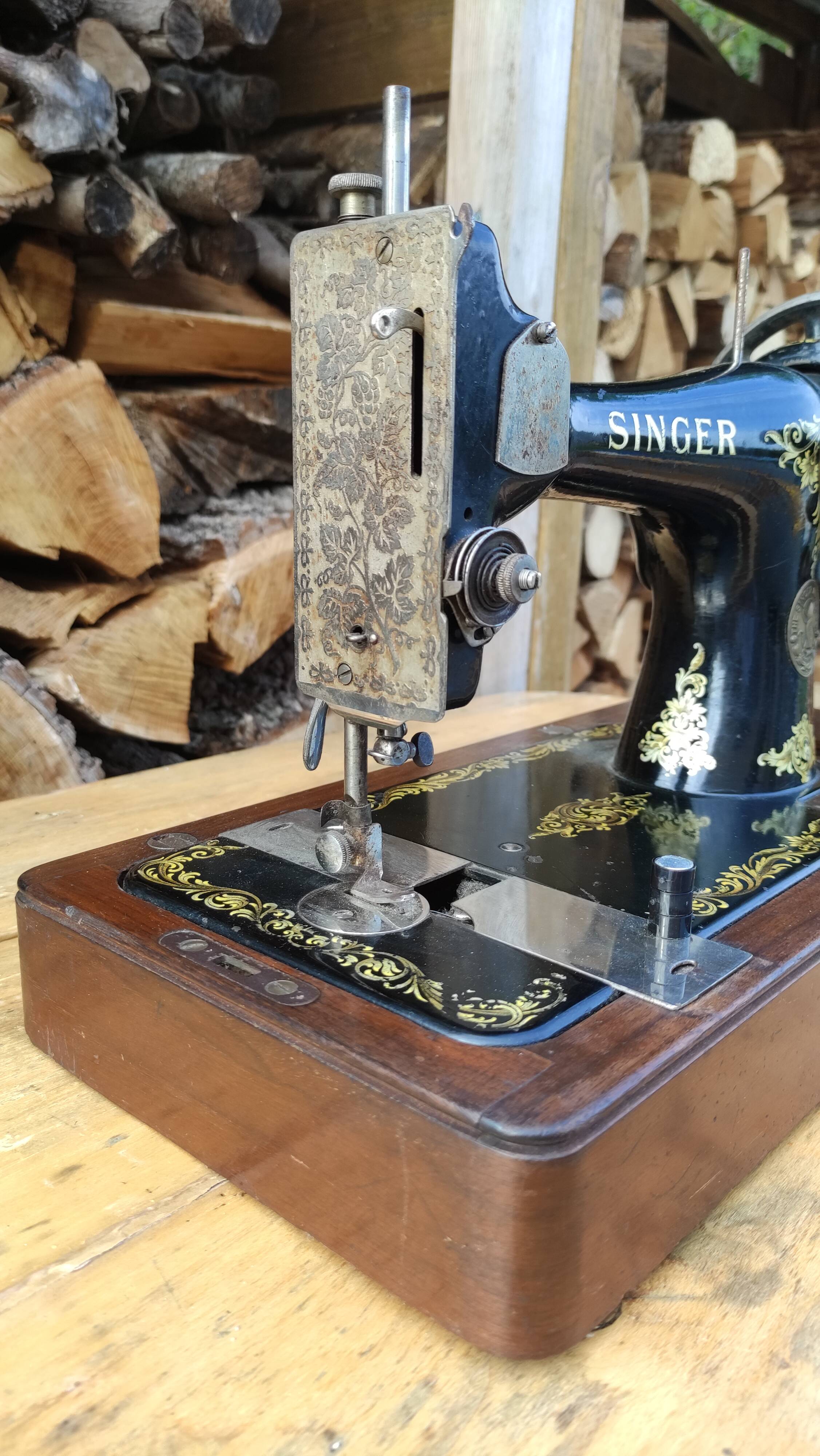 Old Singer sewing machine on its original base