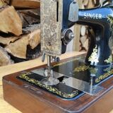 Old Singer sewing machine on its original base