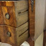 Louis XV style commode with a projection in marquetry.