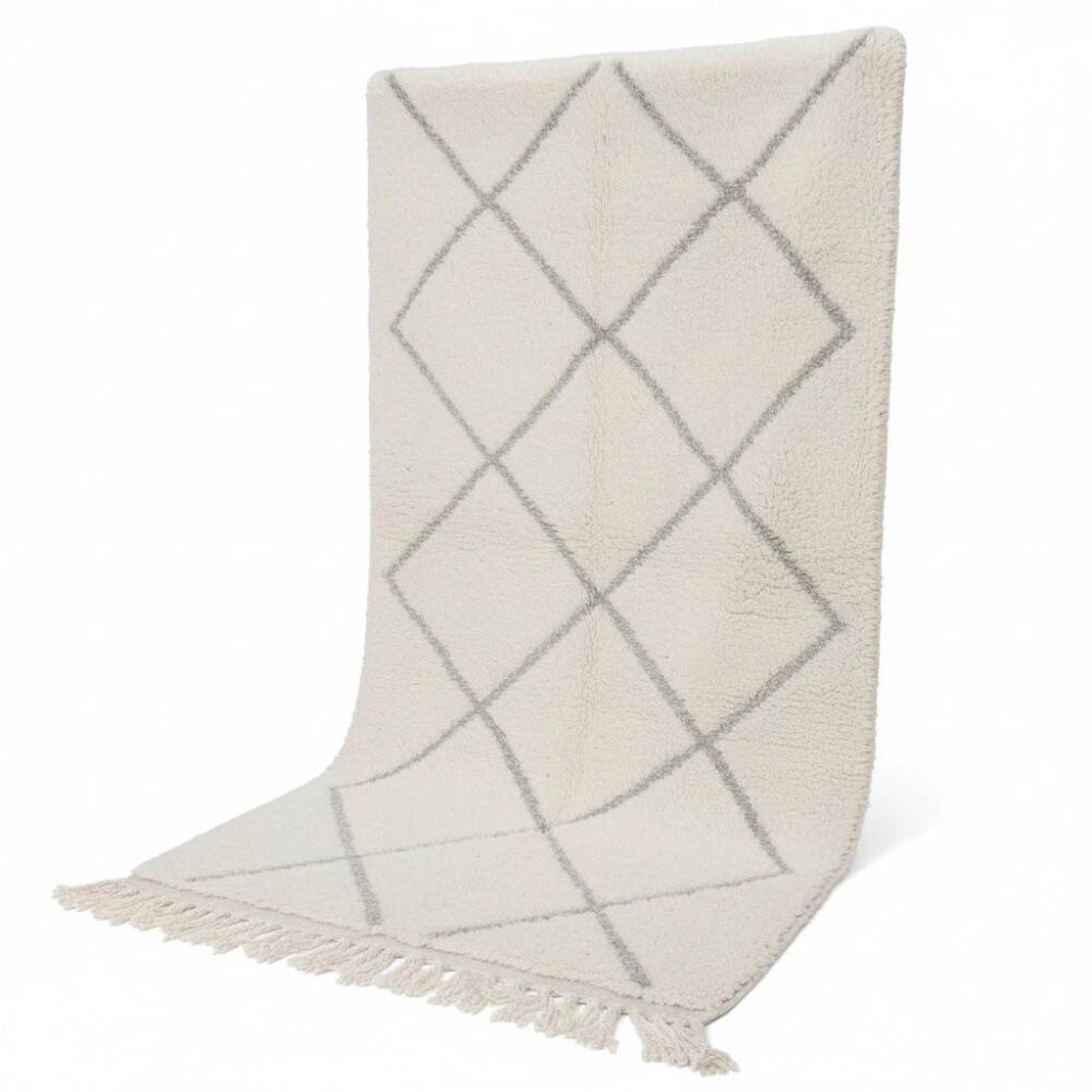 Small white Moroccan rug with diamond patterns