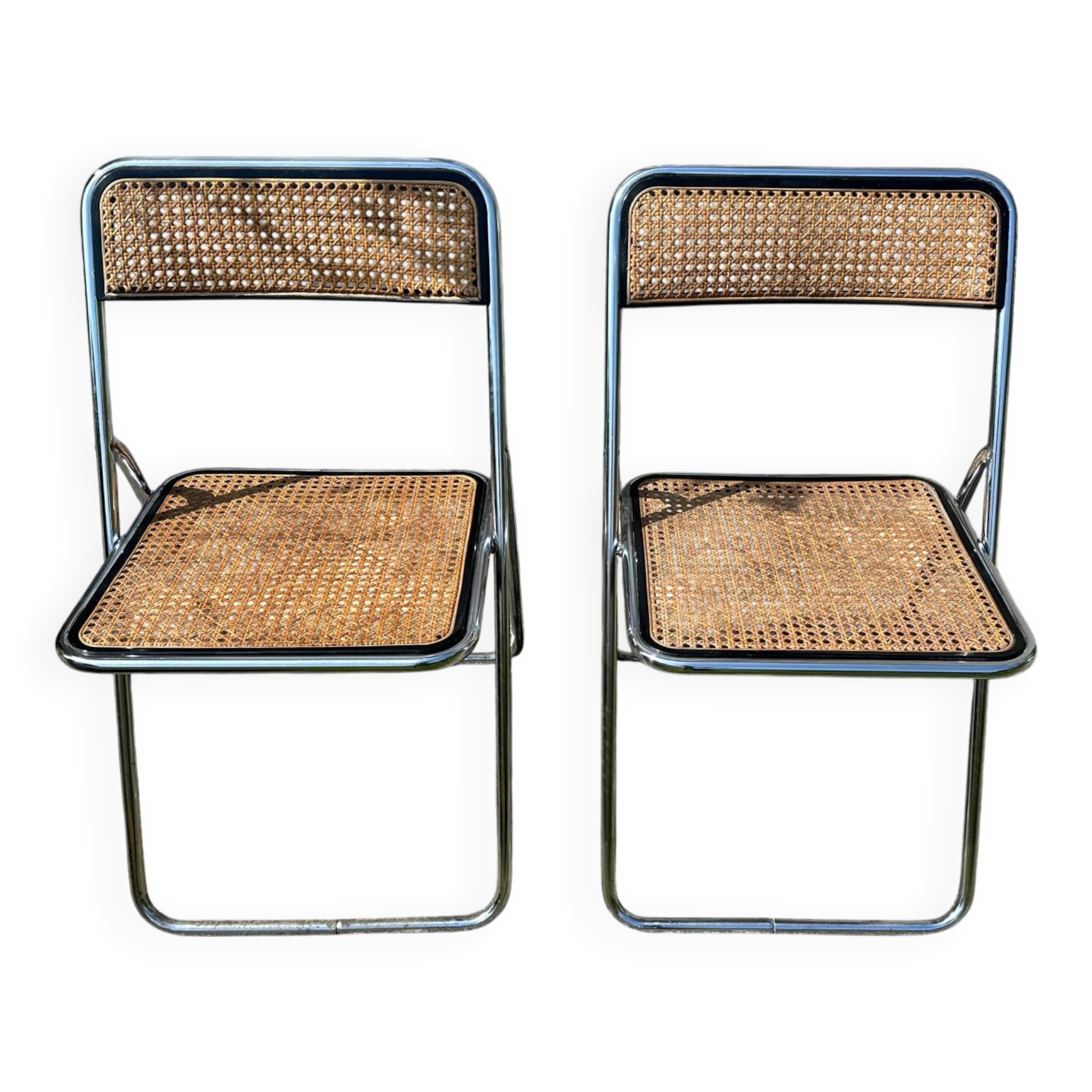 Pair of vintage metal caned folding chairs