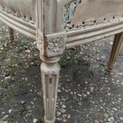Antique armchair in Louis XVI style from the late 19th century.