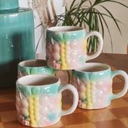 Set of 4 vintage multicoloured slipware coffee cups.