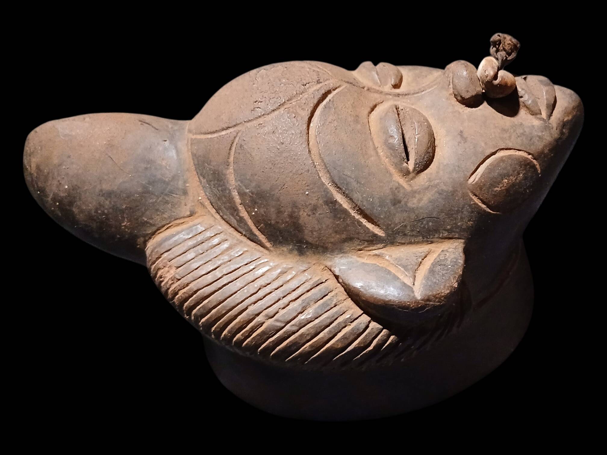 Terracotta mask from the Punu people of Gabon.