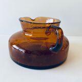 Decanter made of blown and bubbled amber glass