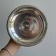 Silver-plated metal stand.