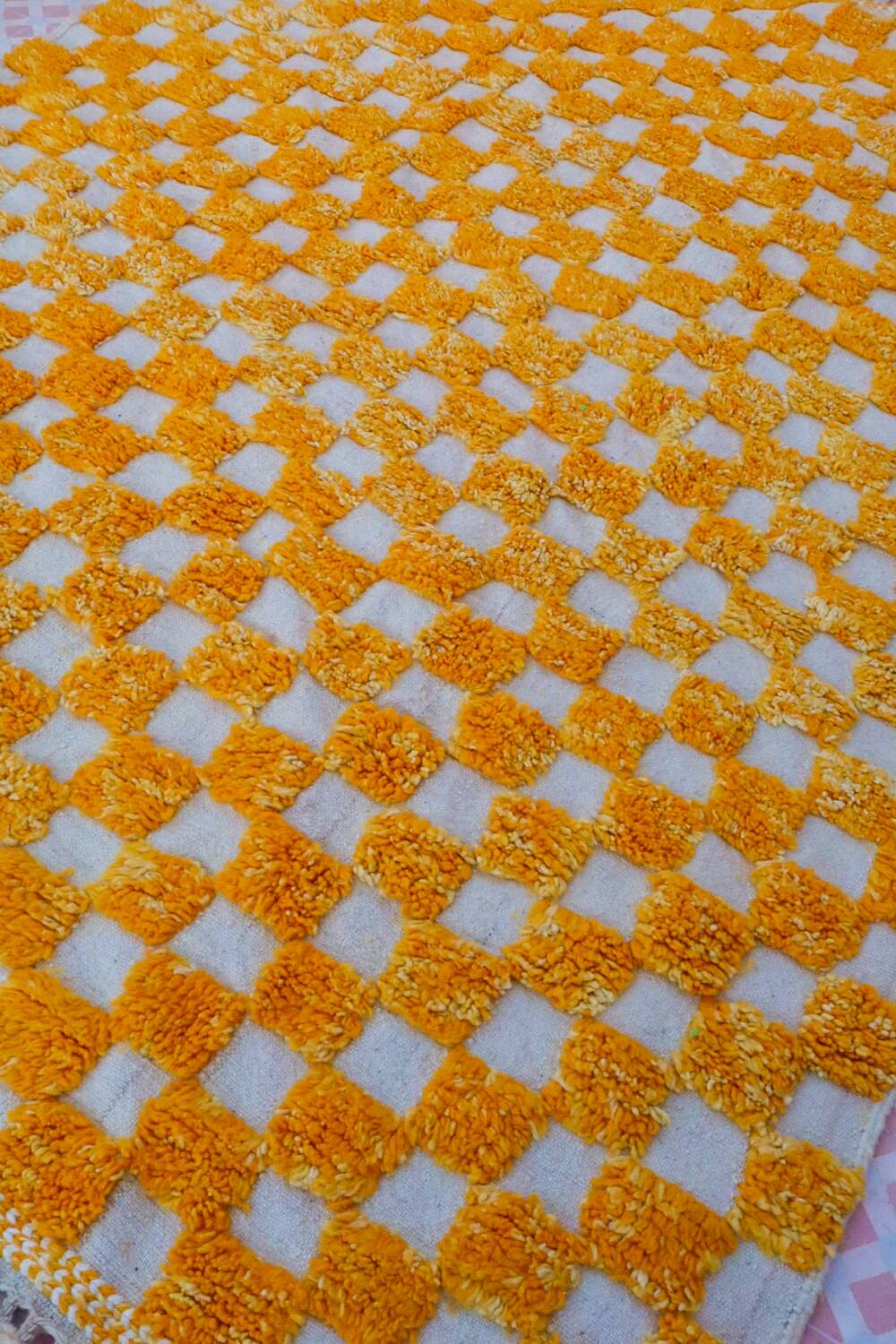 Yellow and white checkered Berber rug