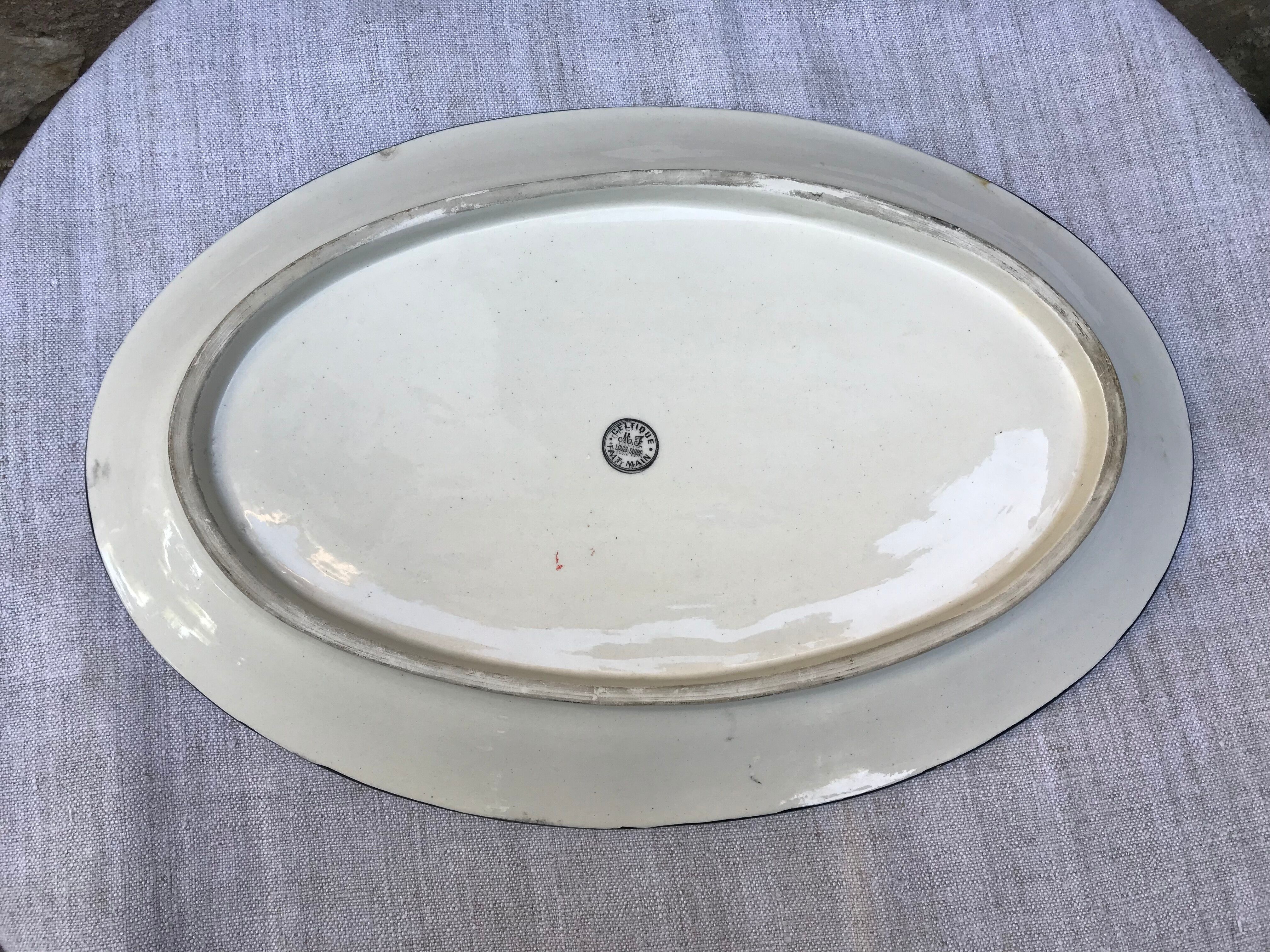 Old faience dish, Scéne Bretonne after Louis Suire and Masse Frères