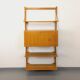 Wall shelf library with vintage light wood secretary bar