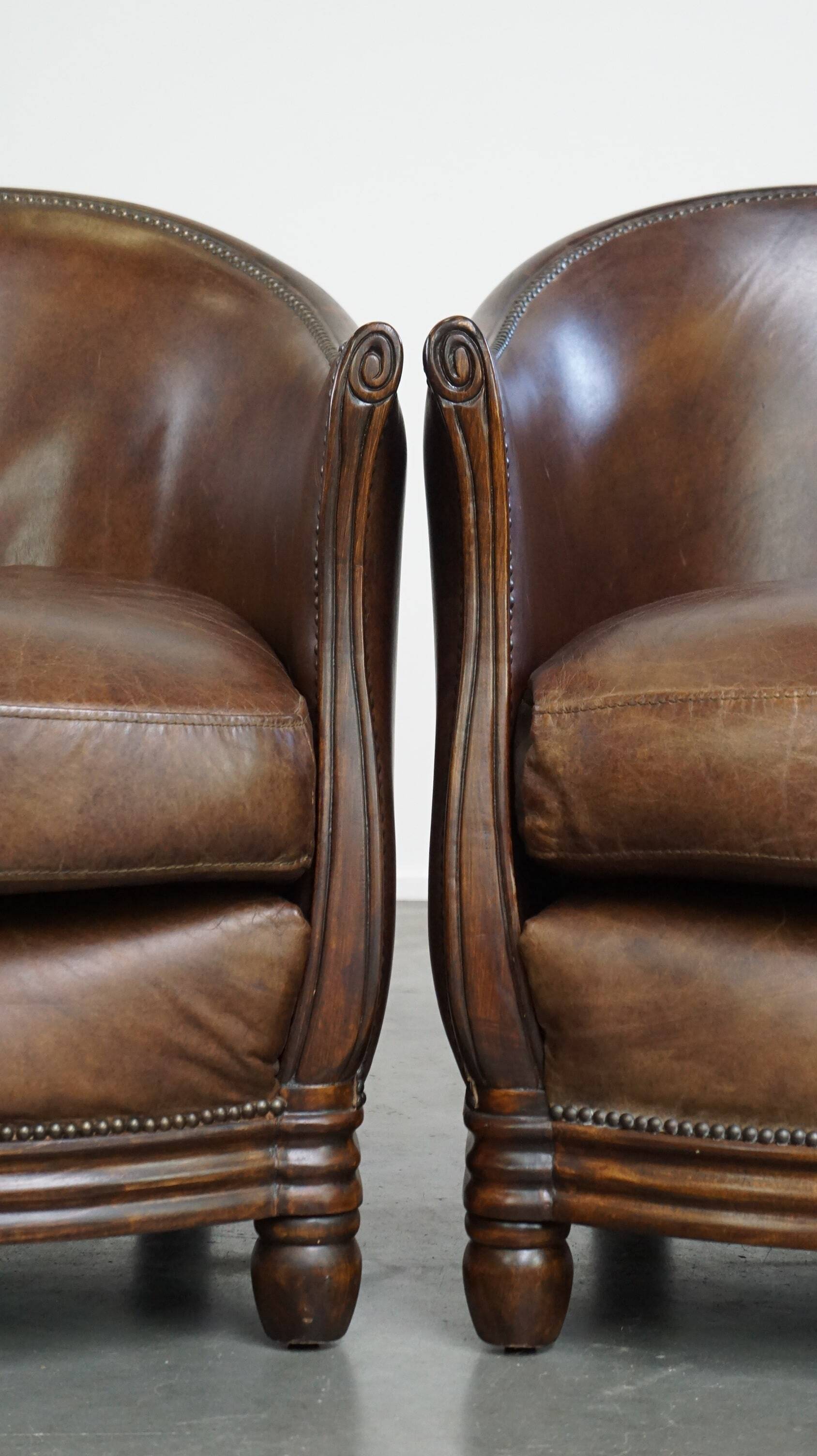 Set of 2 club chairs/armchairs in dark cognac leather