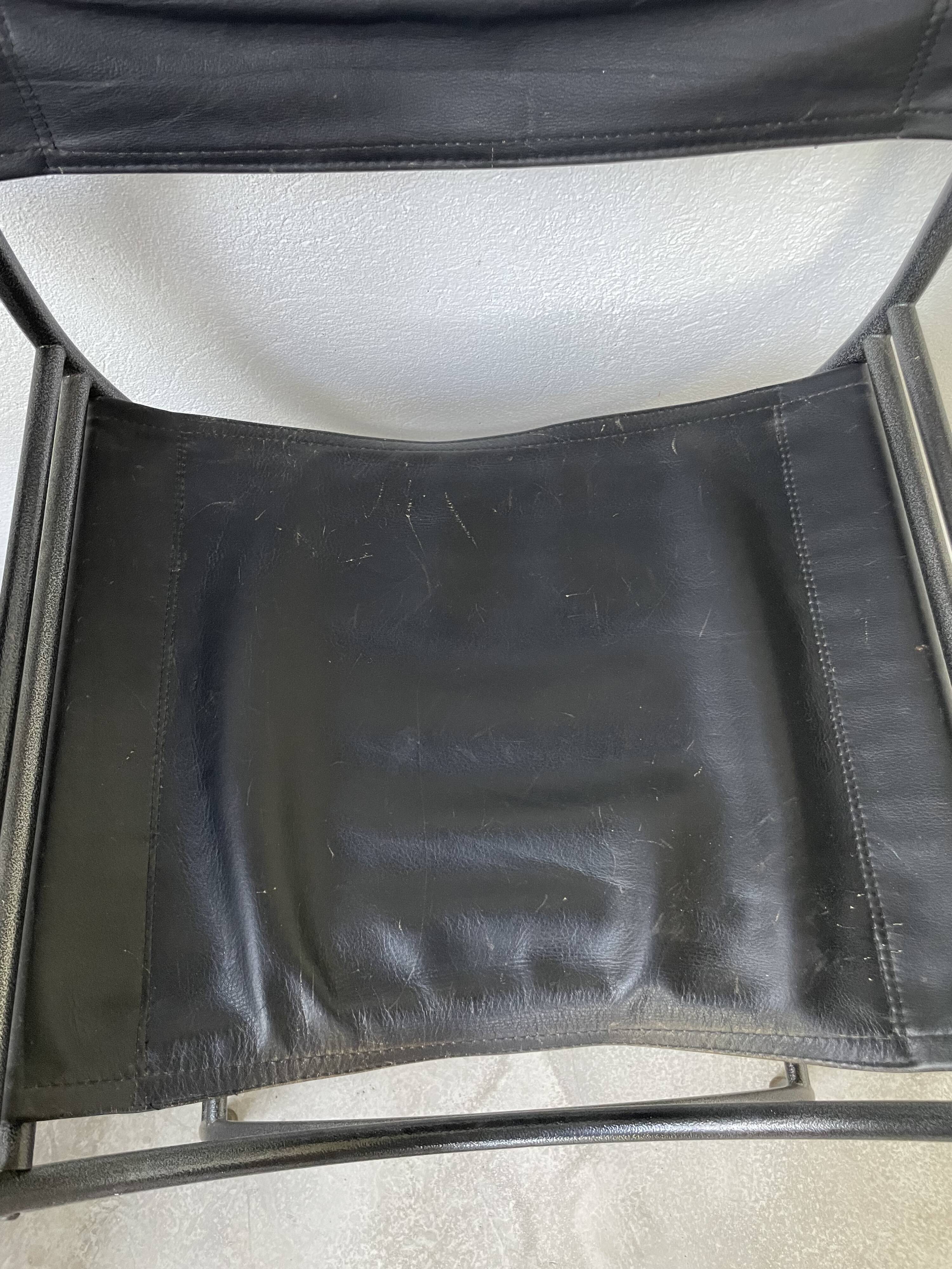 Pair of leather “curule” emperor armchairs