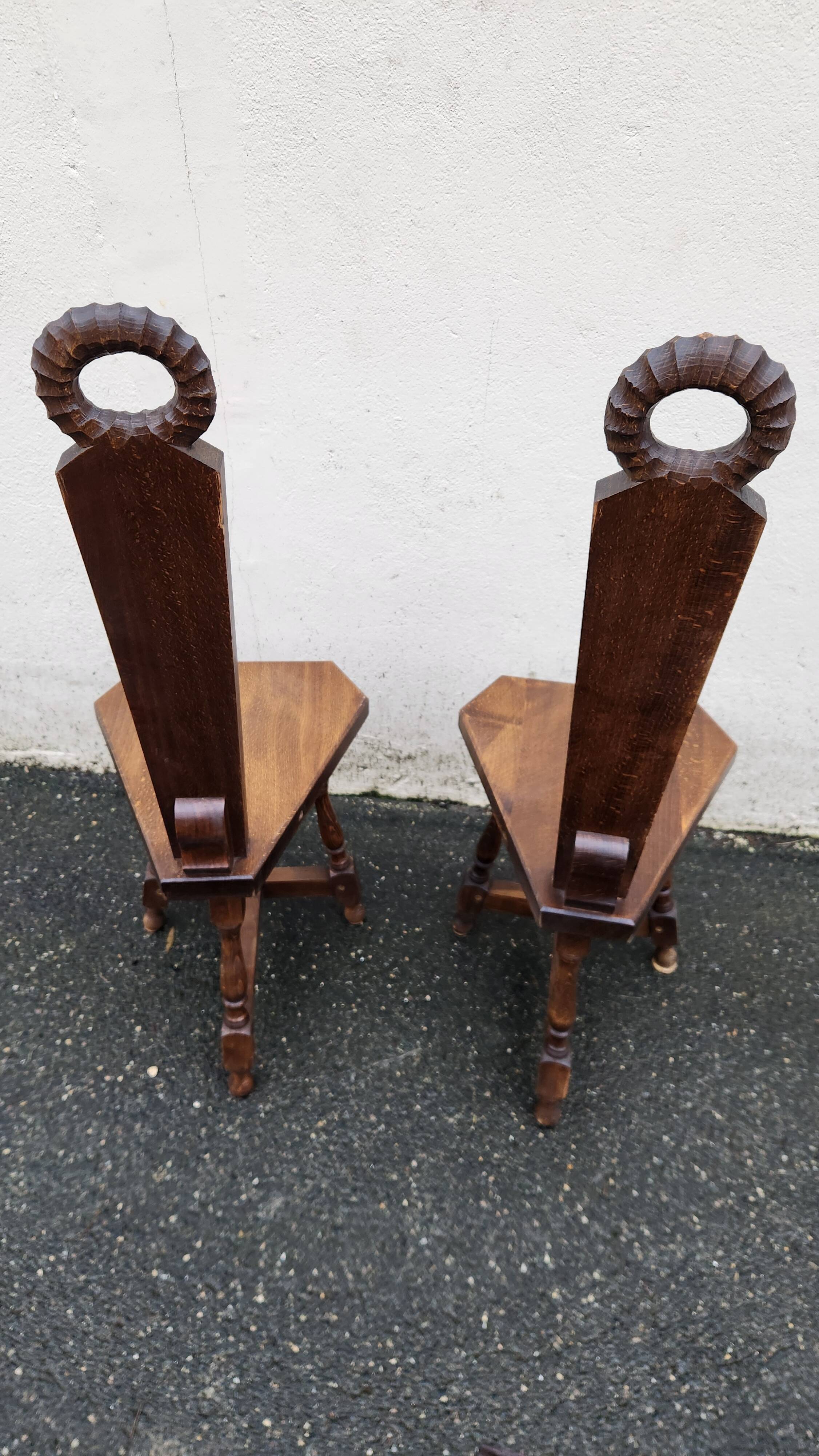 2 three-legged chairs made of solid wood