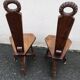 2 three-legged chairs made of solid wood