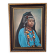 Portrait of a young Moroccan woman in traditional attire and adornments.