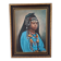 Portrait of a young Moroccan woman in traditional attire and adornments.