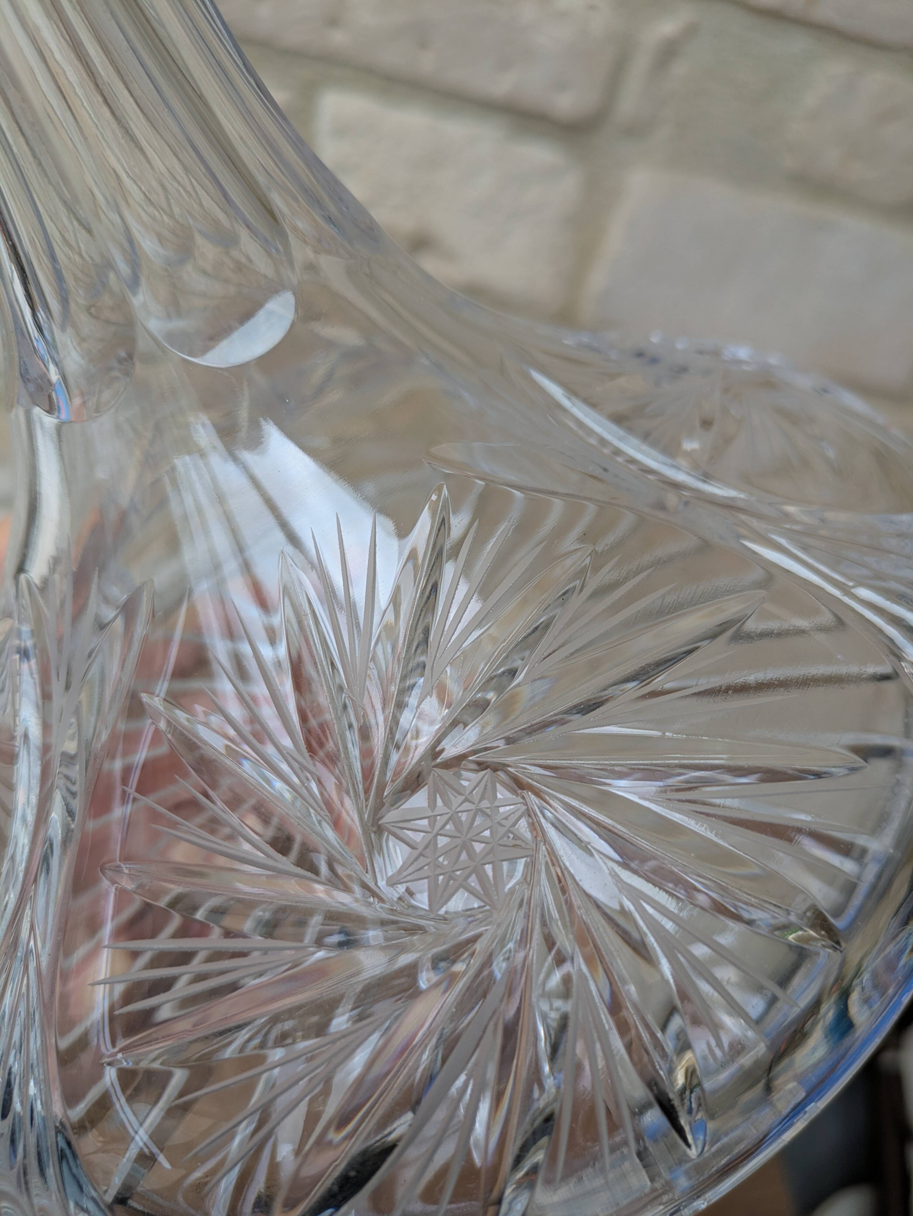 Antique cut crystal decanter with stopper.