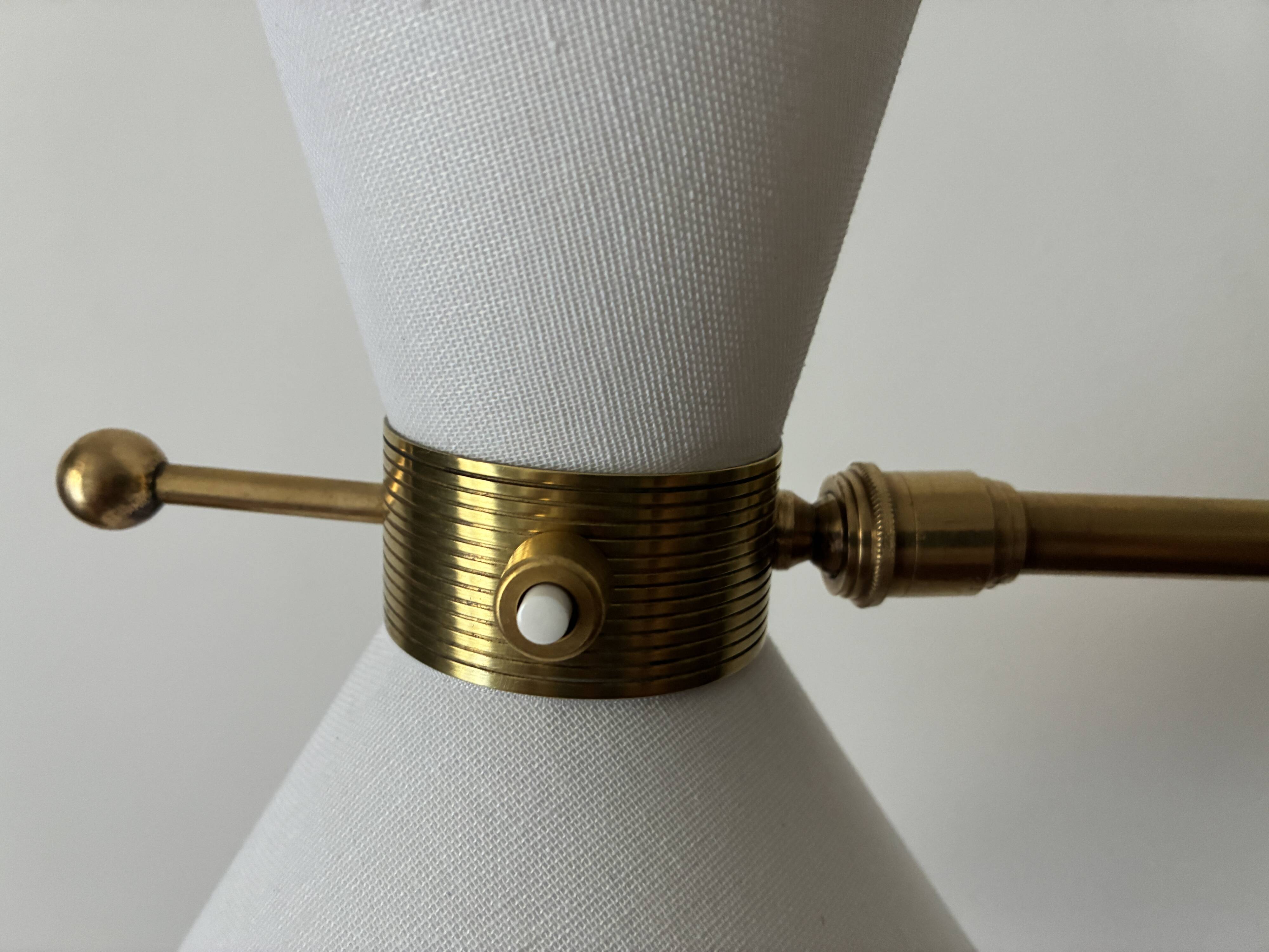 Adjustable Diabolo floor lamp in brass - 1950s