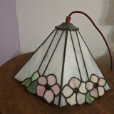 Tiffany-style stained glass lampshade with floral motifs.