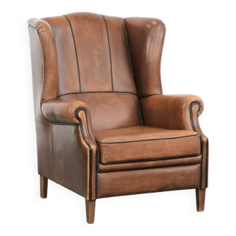 Sheepskin wingback armchair with beautiful colours in good condition