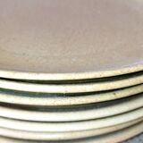 Set of seven plates in sandstone