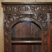 19th-century Anglo-Indian colonial hardwood library on a chest of drawers.