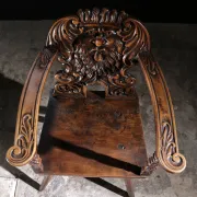 17th century Alpine carved walnut Brettstuhl armchair with grotesque mask
