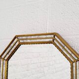 Octagonal mirror in Venetian style with gold-rimmed parecloses