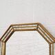 Octagonal mirror in Venetian style with gold-rimmed parecloses