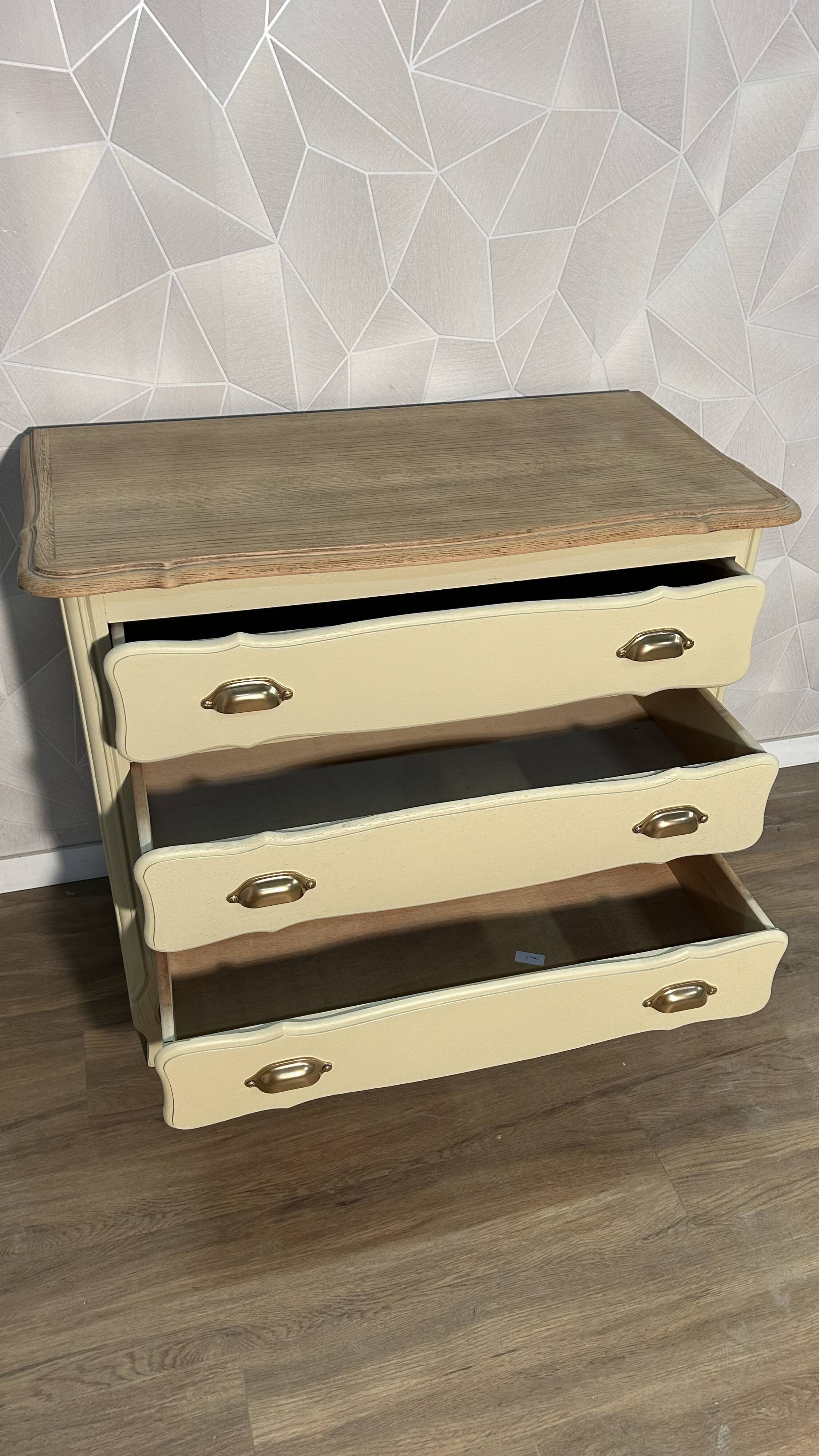 Old chest of drawers refurbished in beige cream
