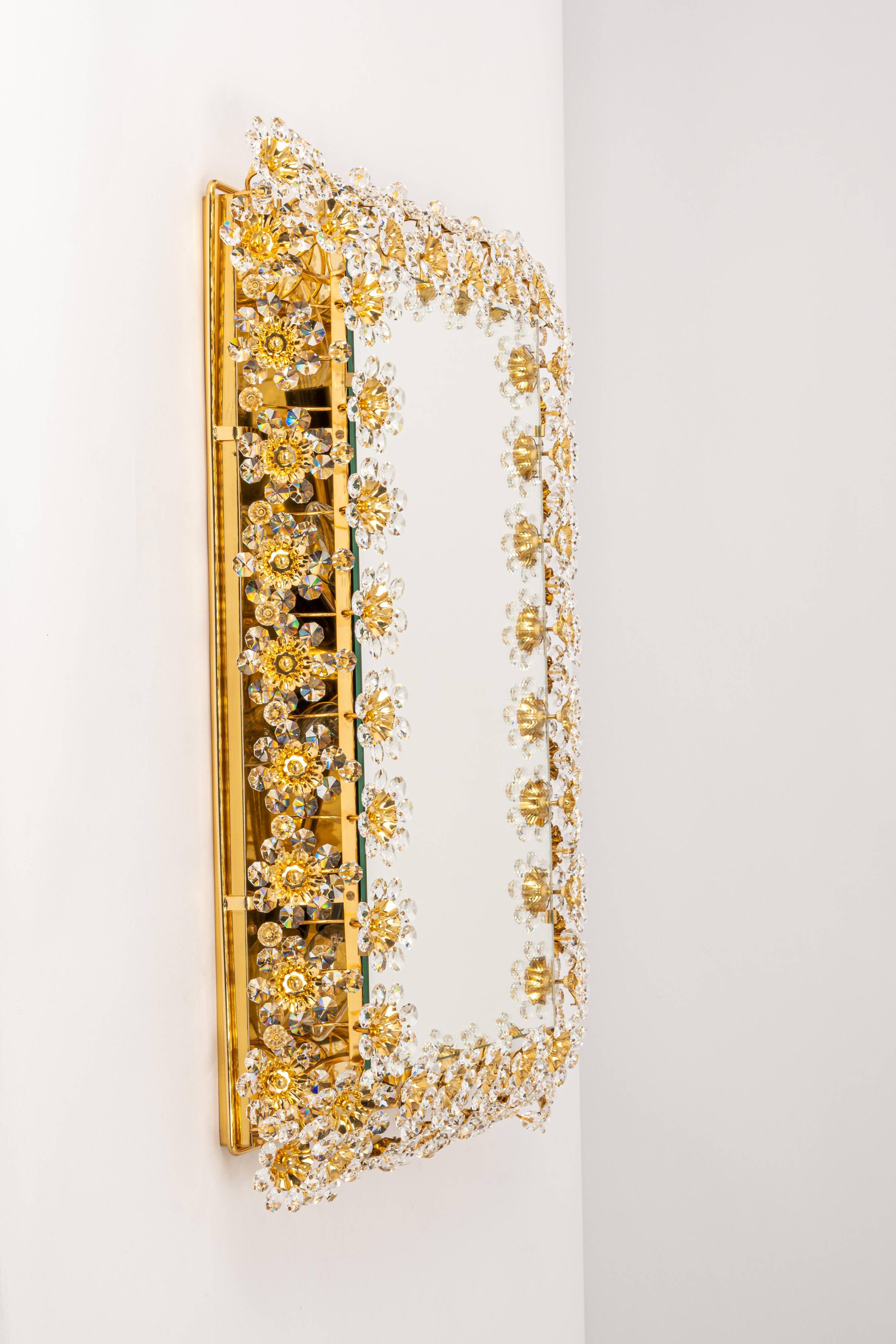 Spectacular backlit mirror in gilded brass and crystal glass by Palwa, Germany.