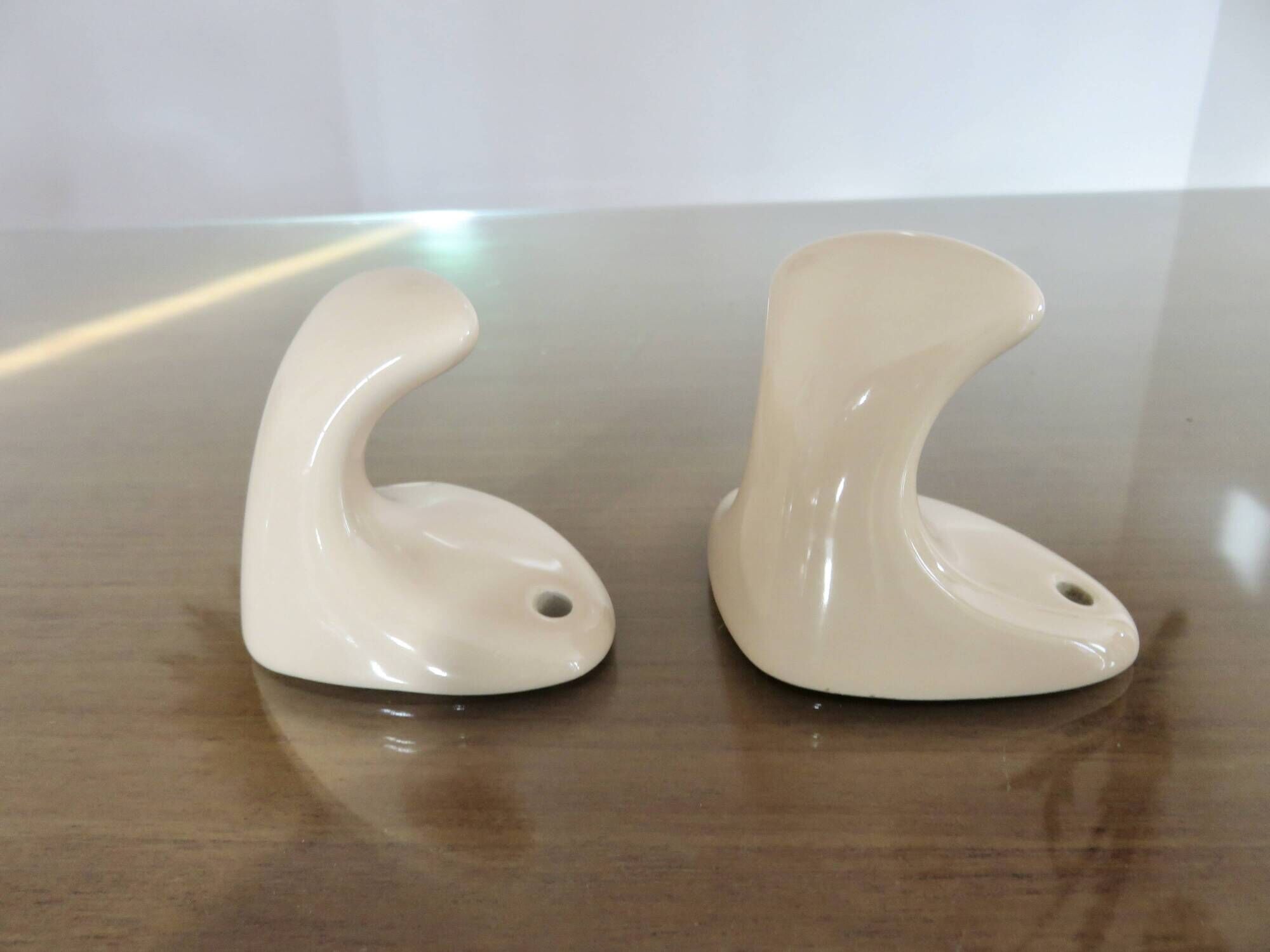 Pair of salmon-colored art deco porcelain hooks from the 30s and 40s