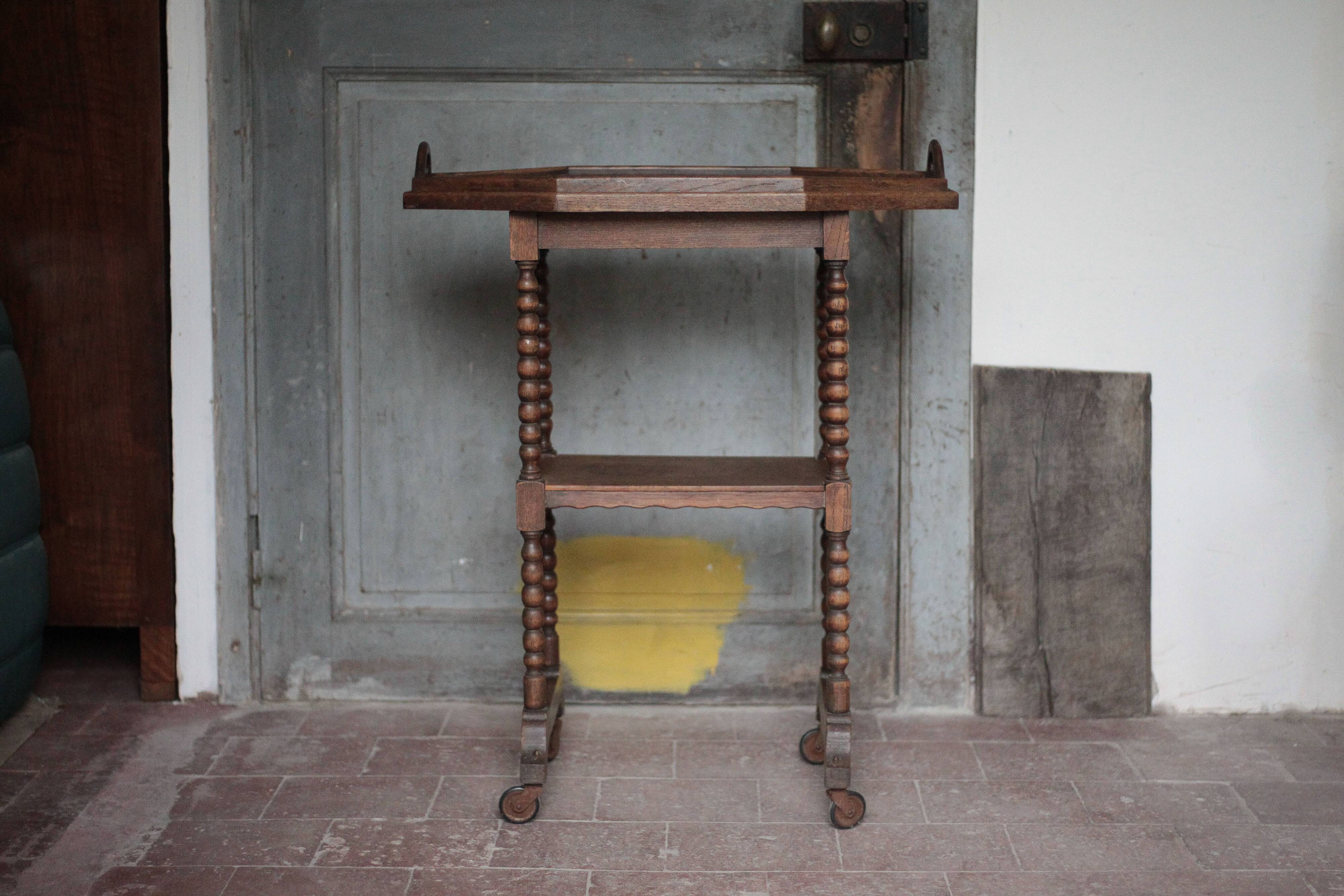 Vintage turned wood dessert trolley, wheeled table with removable top.